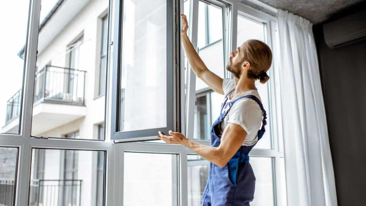 man maintaining upvc windows